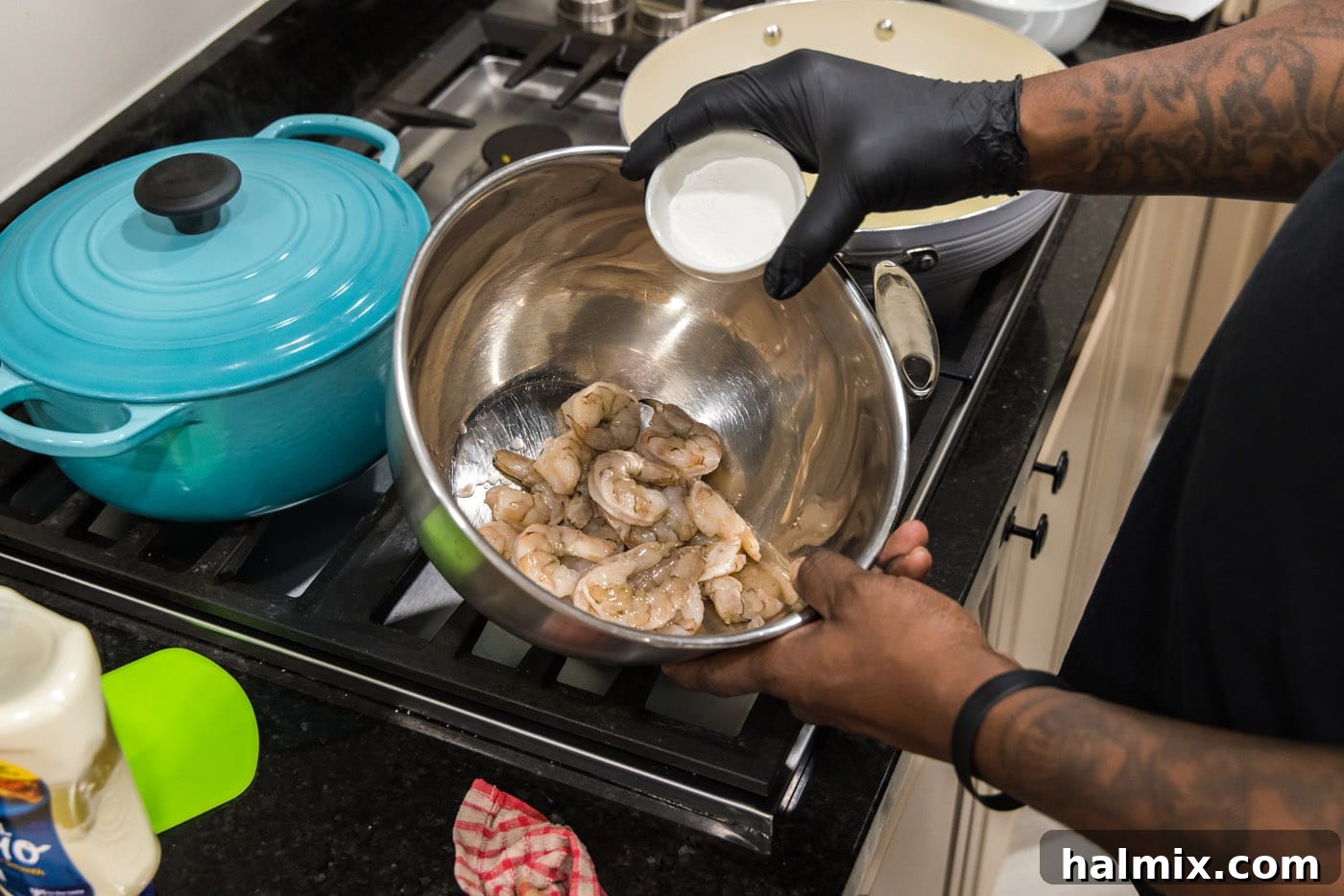 Tossing shrimp in cornstarch