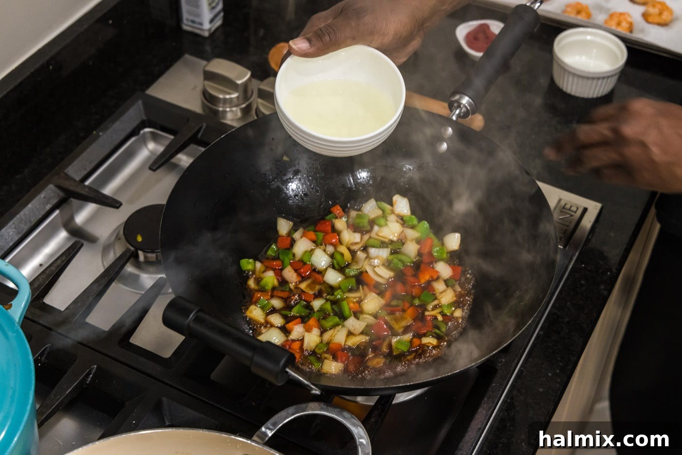 adding pineapple juice to skillet with veggies