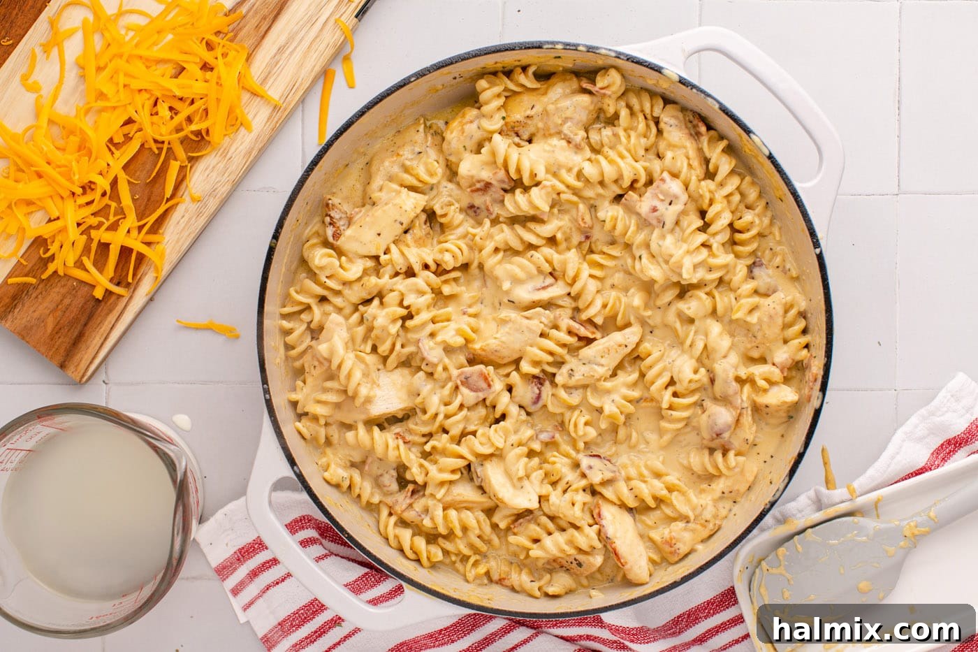 A finished overhead view of the decadent Creamy Chicken Bacon Ranch Pasta dish, garnished and ready to serve.