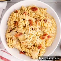 Bowl of Creamy Chicken Bacon Ranch Pasta, garnished and ready to serve.