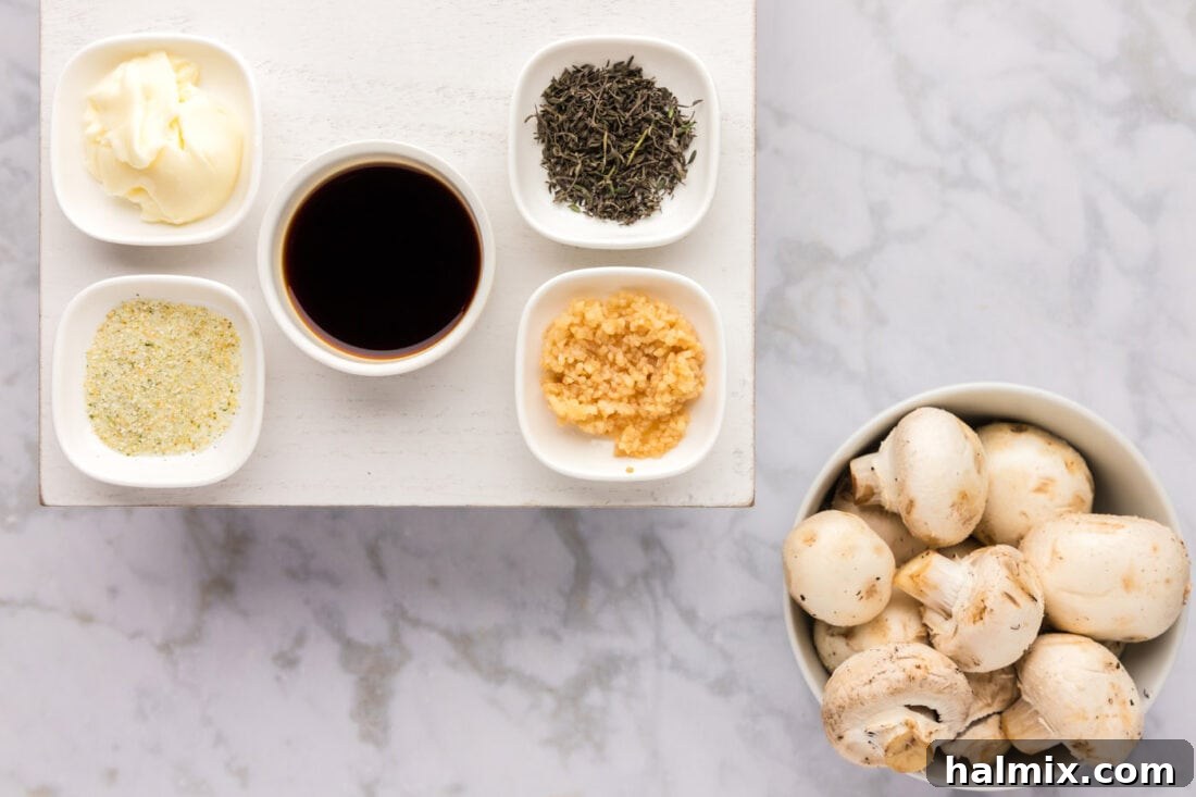 Fresh ingredients laid out for making Sauteed Mushrooms: sliced mushrooms, butter, thyme, garlic, and soy sauce.