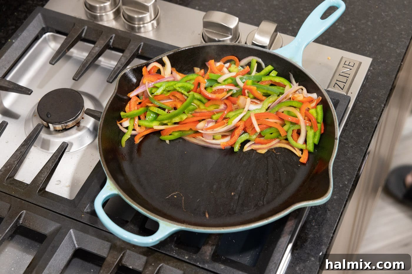 fajita veggies on one side of skillet