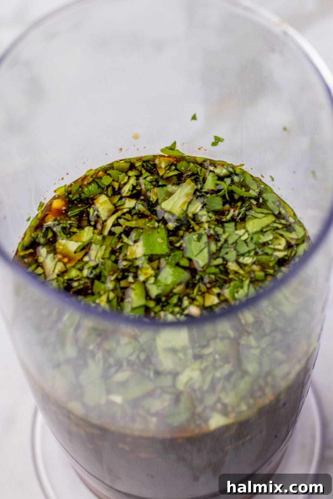 Close up photo of Fajita Marinade being blended in an immersion blender cup