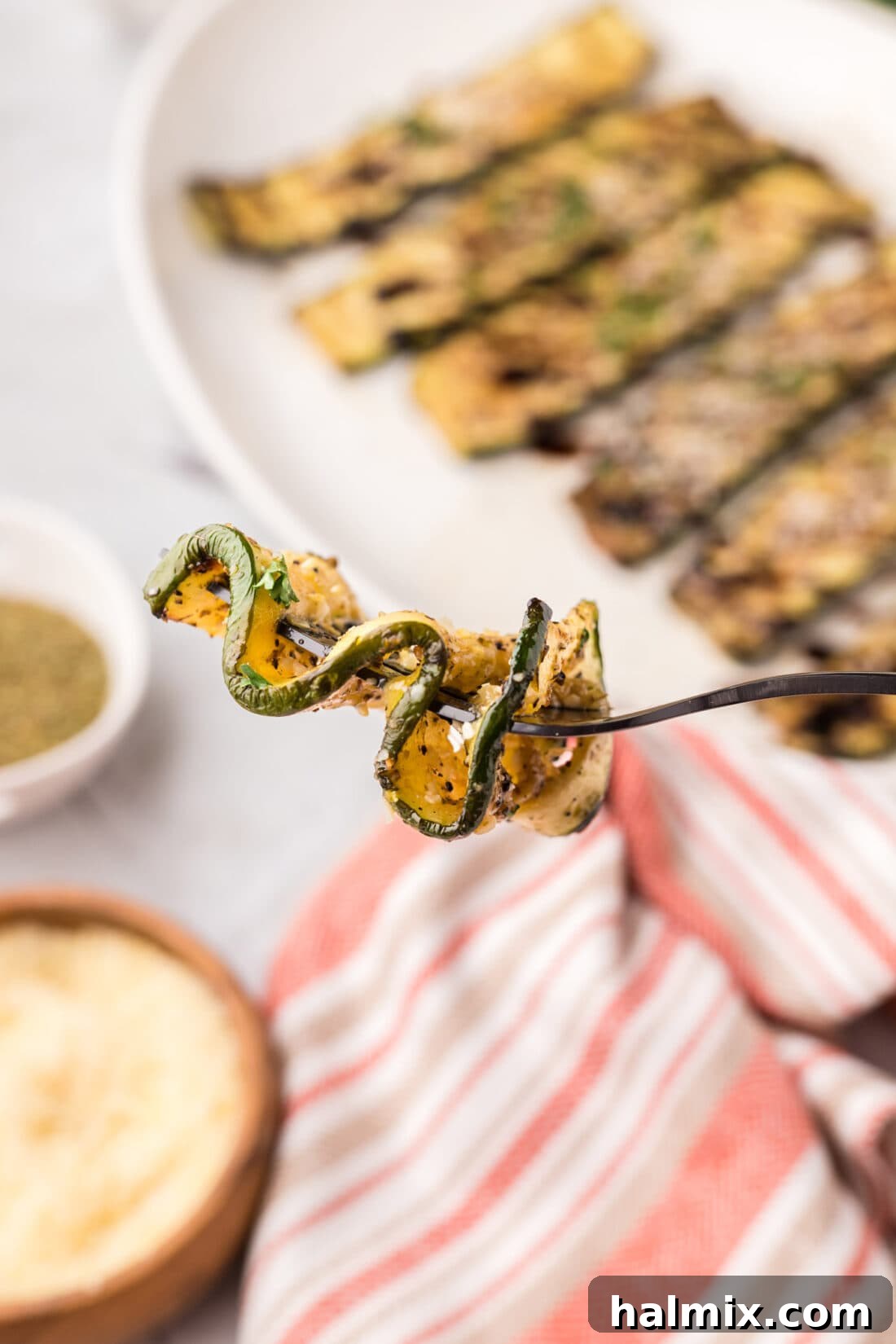 Piece of Grilled Zucchini zig-zagged on a fork