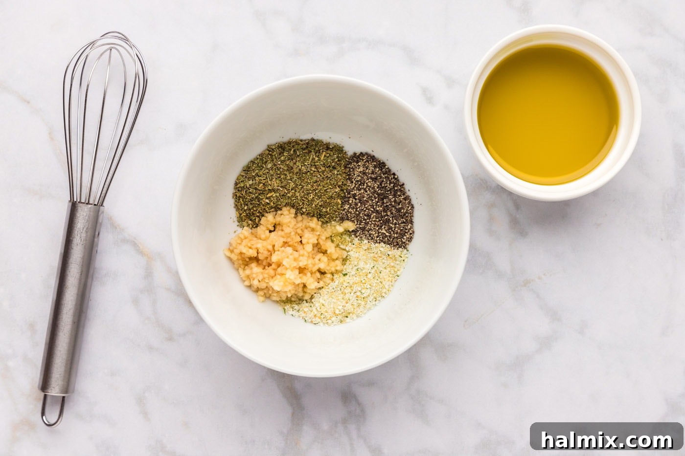 seasonings for zucchini in a bowl with garlic