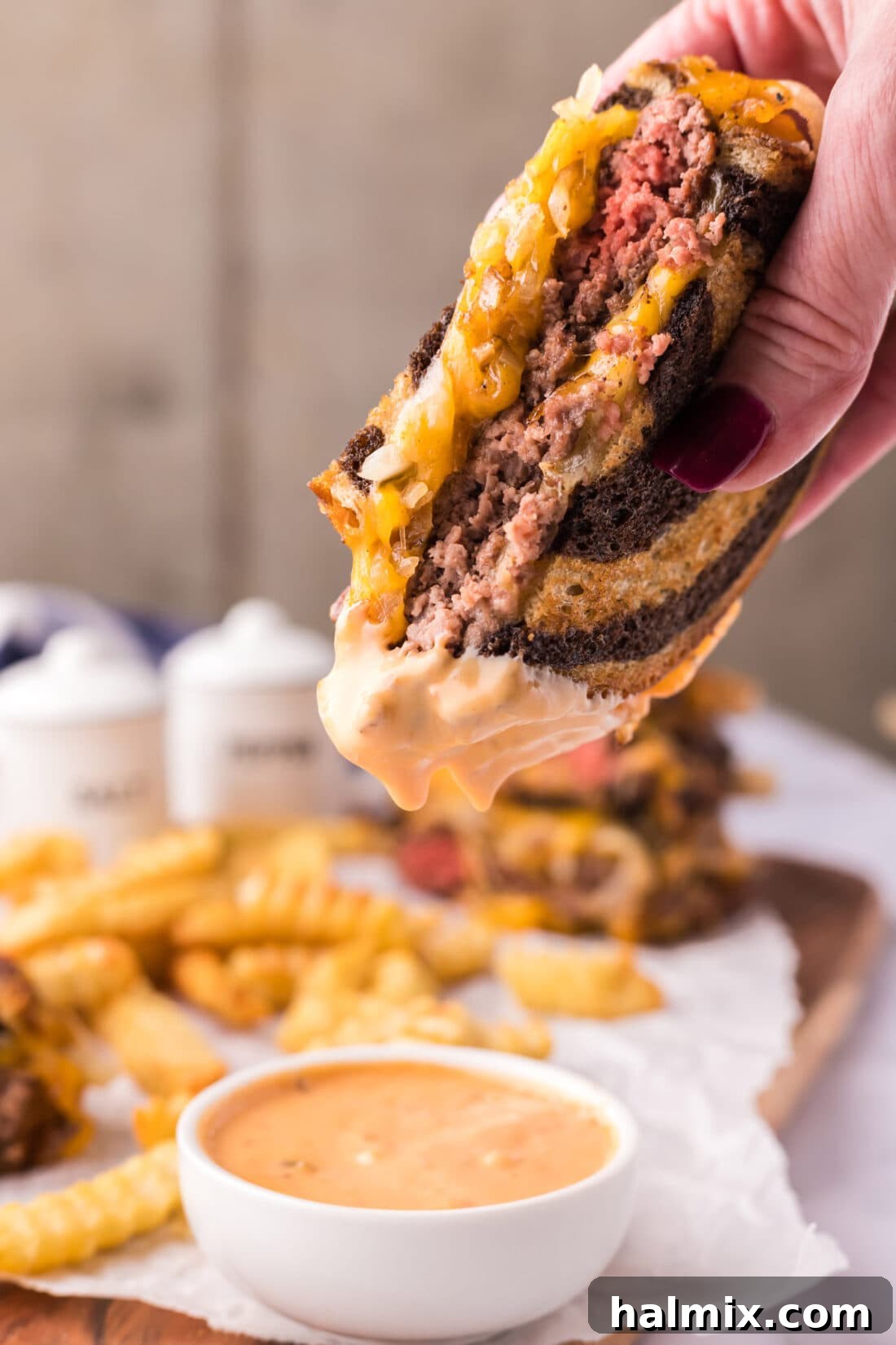 Patty Melt dipped in sauce