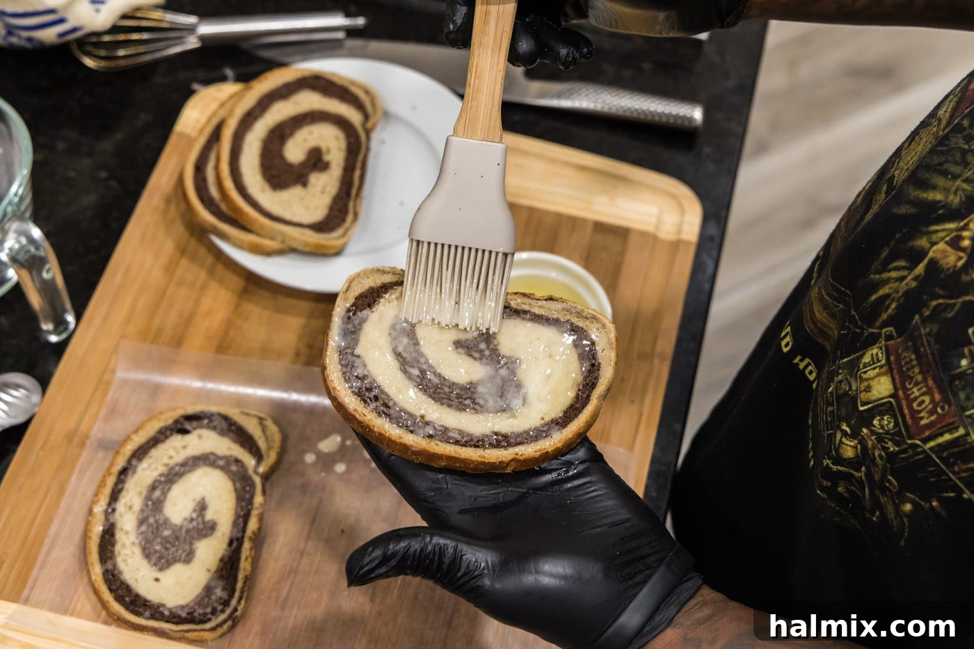 brushing butter on rye bread