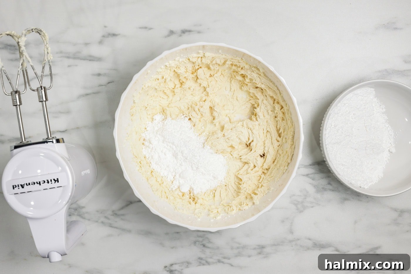 Decadent Carrot Cupcakes 10 powdered sugar in a bowl with cream cheese frosting