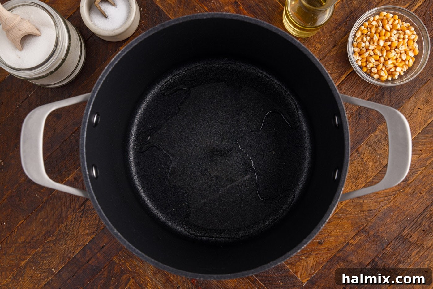 Vegetable oil glistening in a large pot on the stovetop