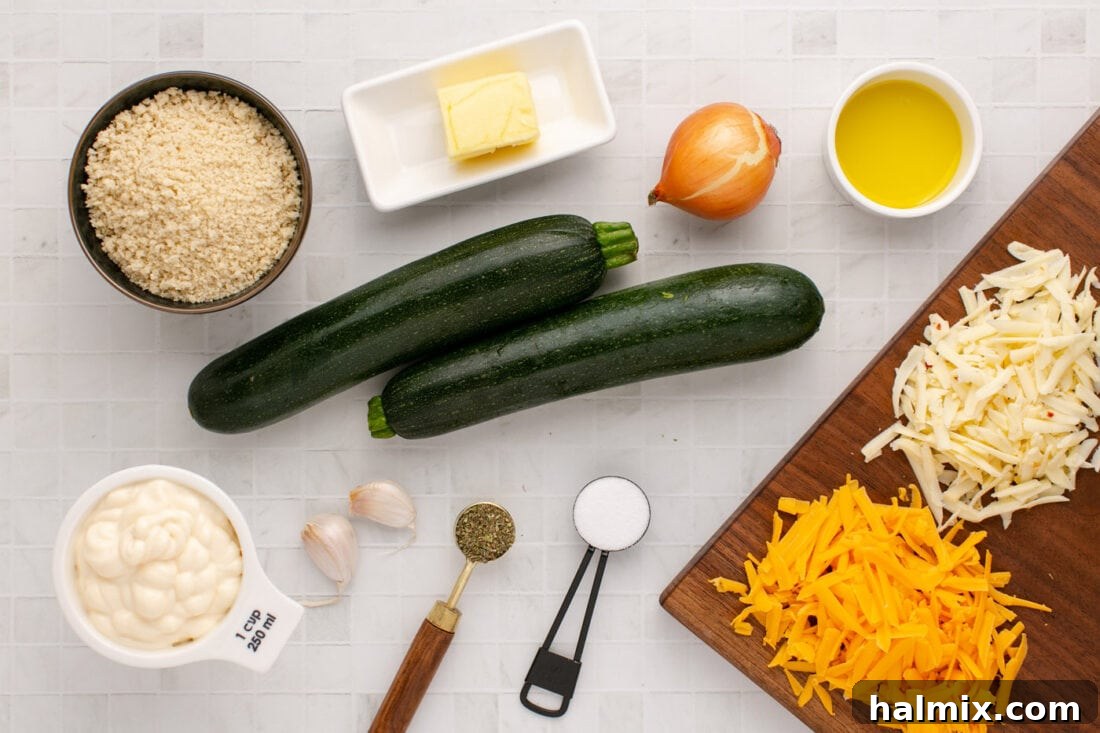 A collection of fresh ingredients for Zucchini Casserole, including zucchini, cheeses, mayonnaise, onion, garlic, and seasonings, neatly arranged on a counter.