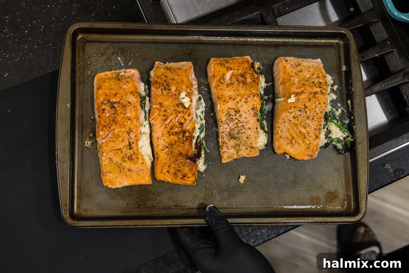 Baked stuffed salmon fillets with crab meat, cooked to perfection and ready to be served.