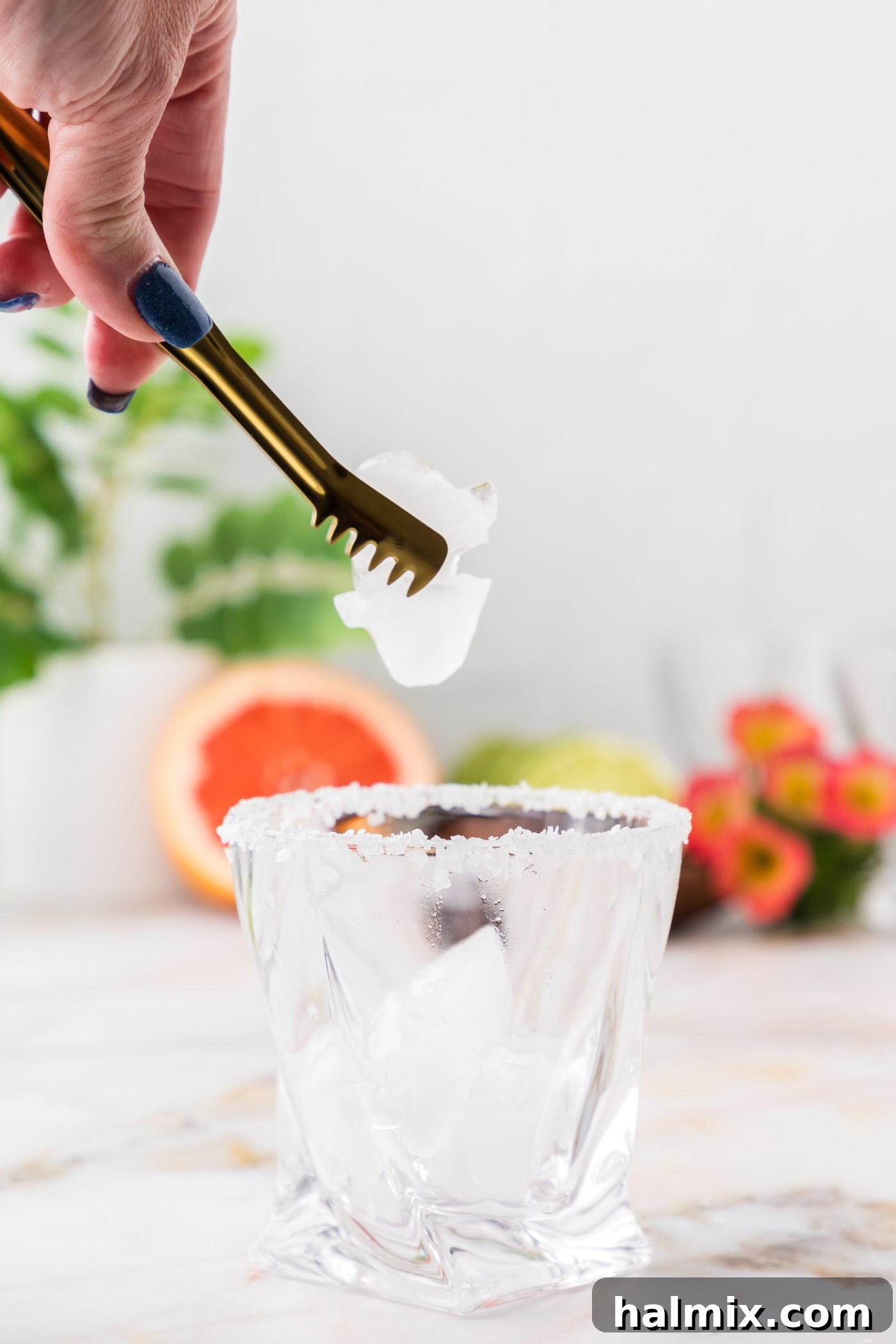 adding ice to rock glass