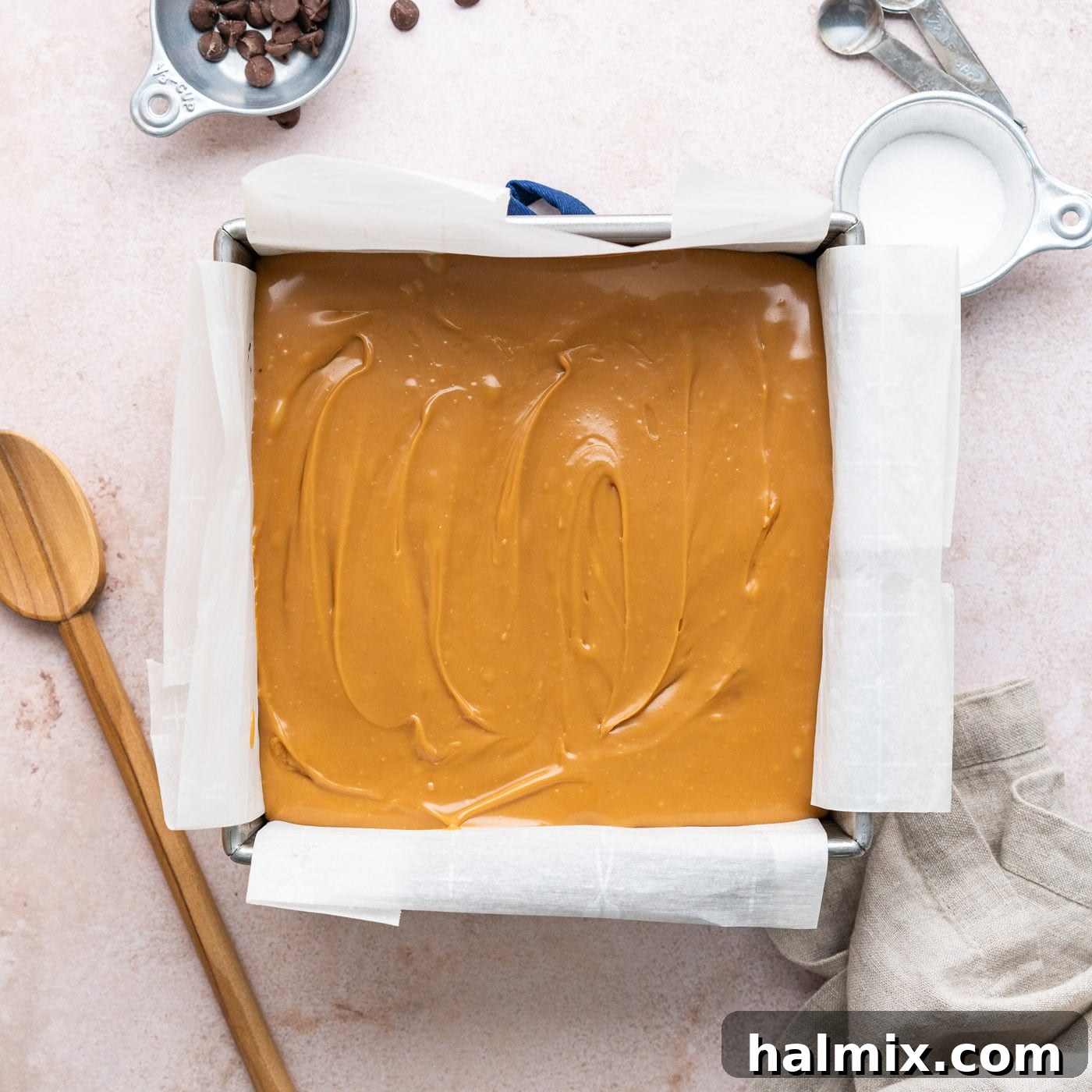 layer of caramel over brownies in a pan