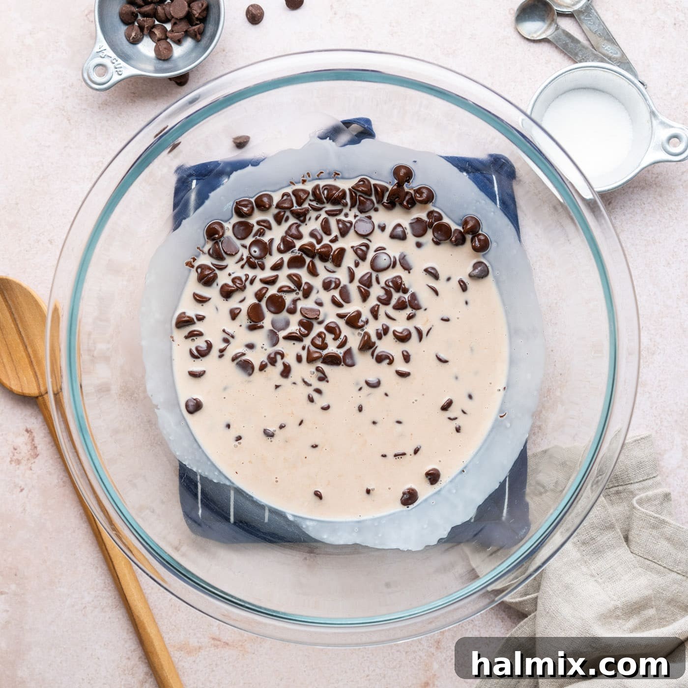 chocolate chips in a bowl with heavy whipping cream