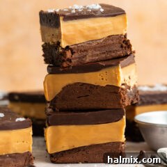 Stack of Millionaire Brownies, perfectly layered and garnished.