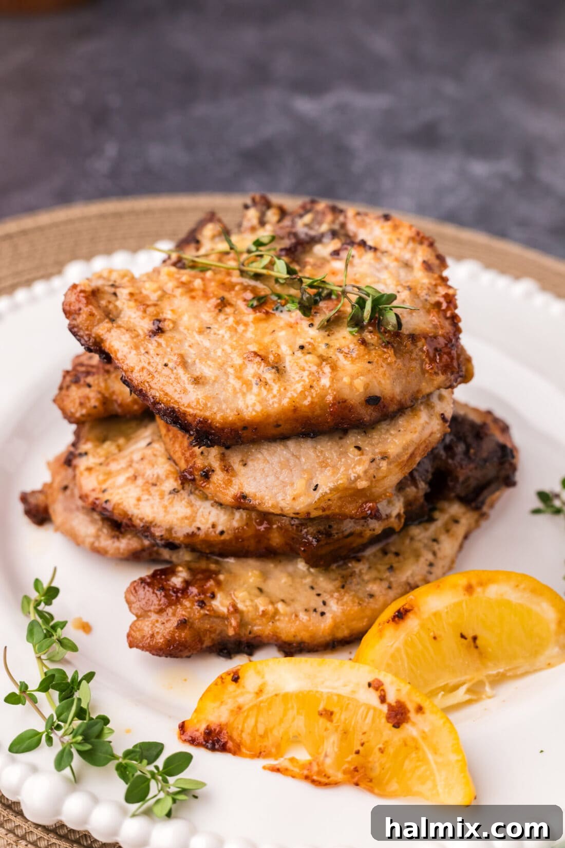 Stack of Garlic Butter Pork Chops on a plate