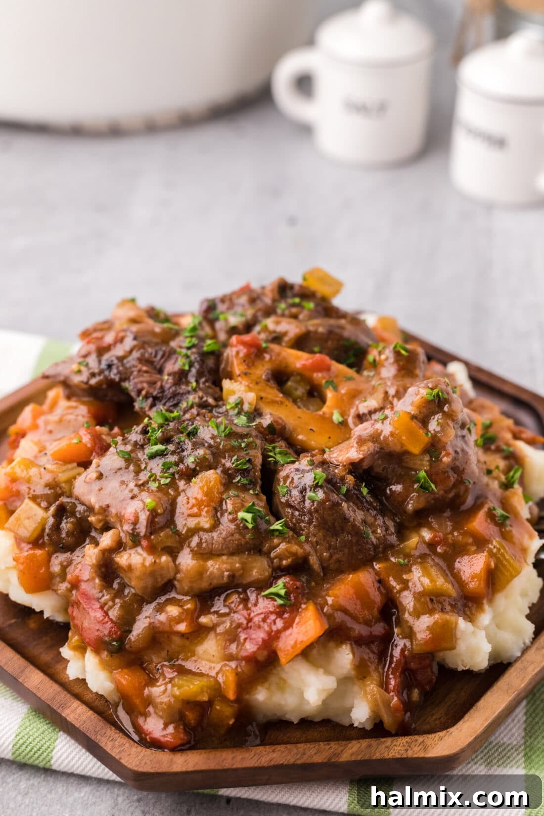 Plate of Braised Beef Shanks, showing tender beef and rich sauce