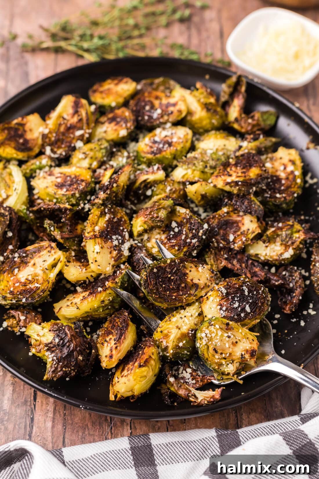 Plate of Roasted Brussel Sprouts with a fork