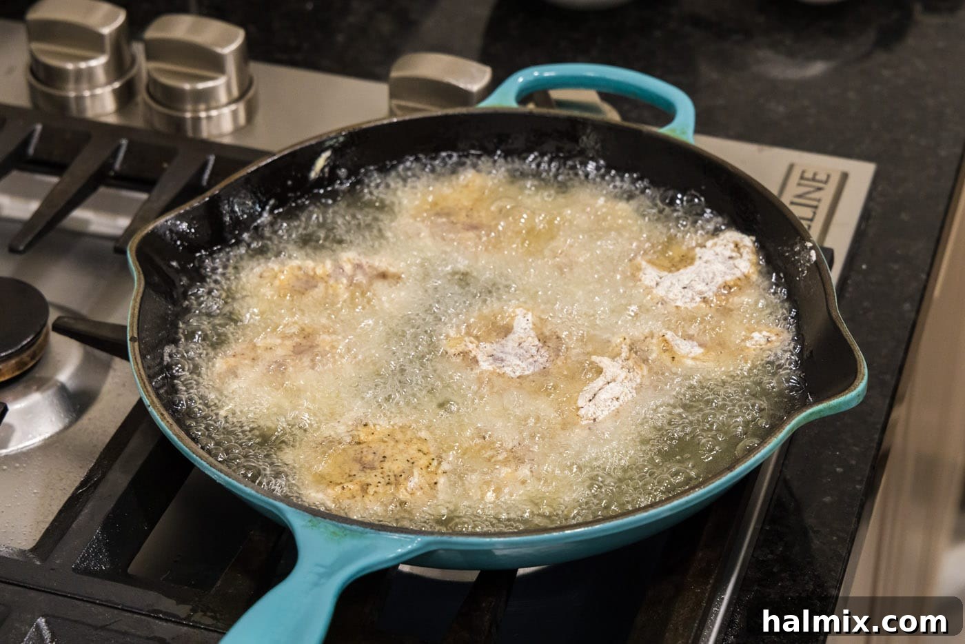 Southern Fried Bliss 13 Dredged chicken thighs frying to a golden crisp in hot oil