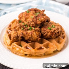 Southern Fried Bliss 18 Close up photo of Crispy Fried Chicken and Waffles on a plate, highlighting the textures