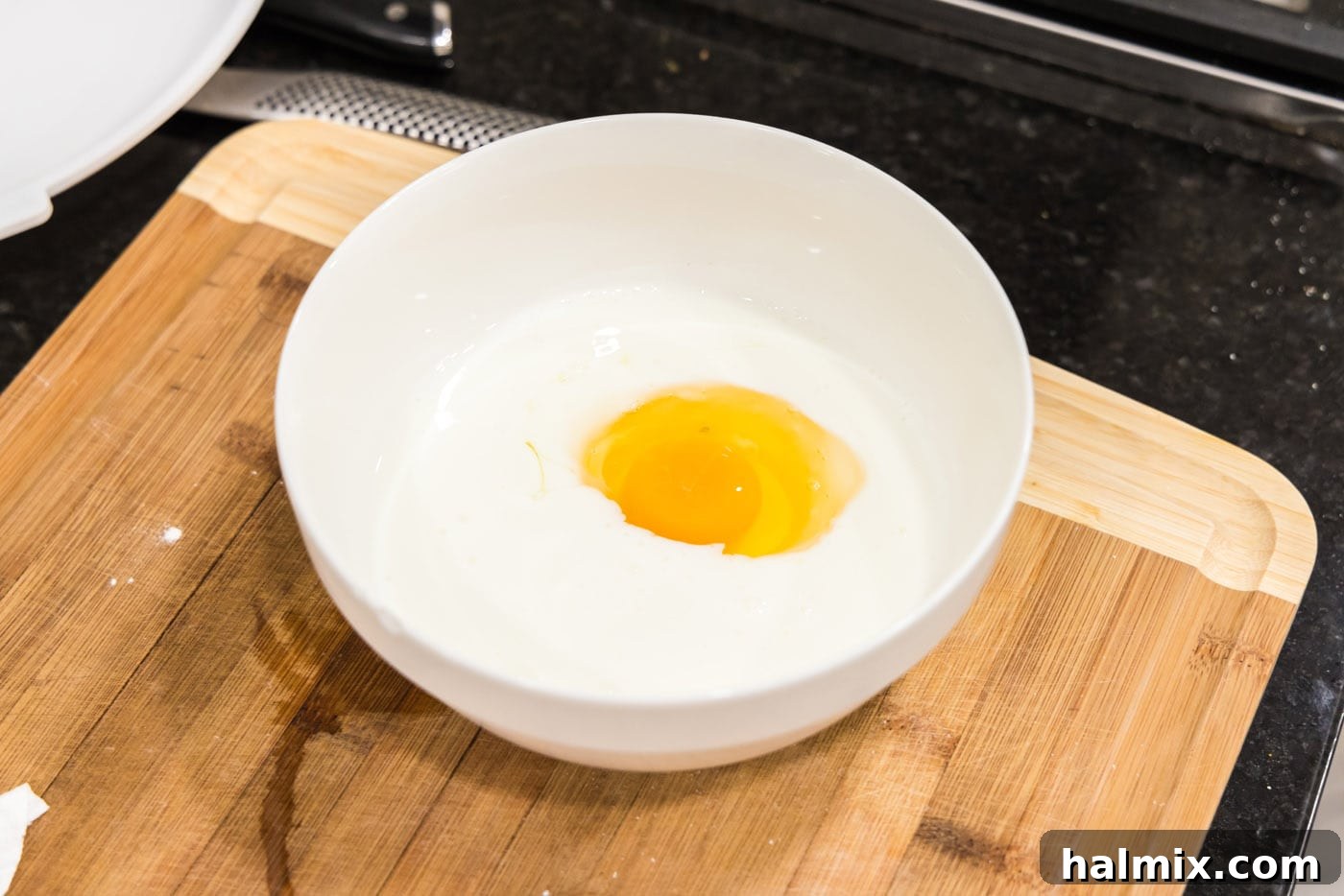Southern Fried Bliss 5 Egg and buttermilk whisked together in a bowl, creating the wet dredge for the chicken