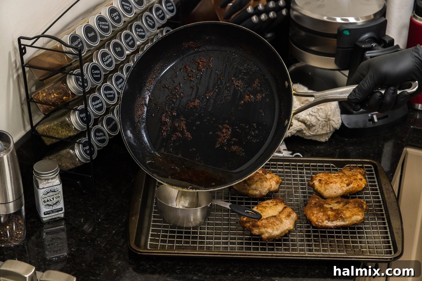 Marsala Veal: Italian Elegance 9 A measuring cup collecting savory pan drippings from a skillet after cooking the veal