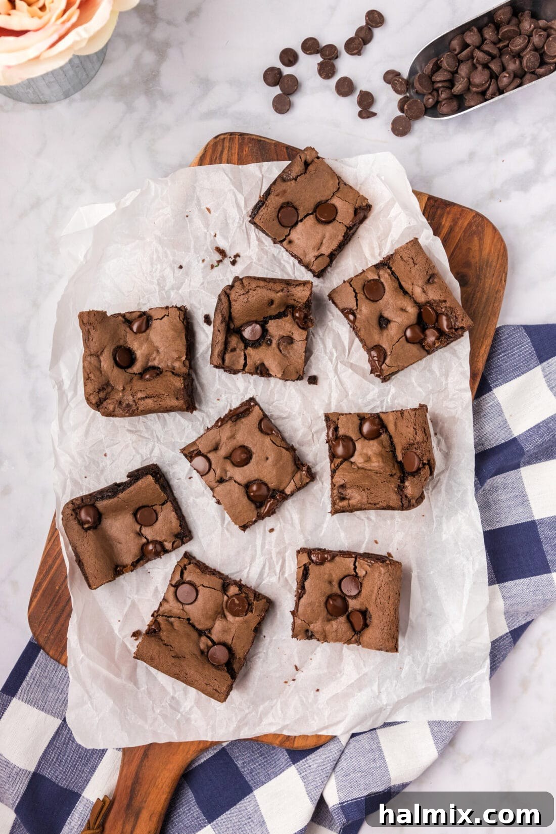 Cake Mix Brownies cut into squares on parchment paper, showcasing their fudgy texture
