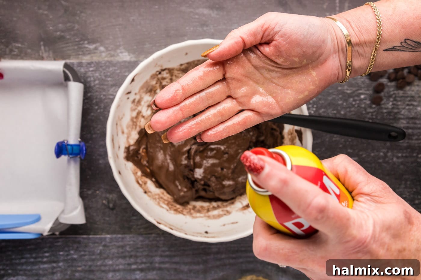 spraying hands with cooking spray