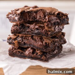 Stack of Cake Mix Brownies with a bite taken out of the top one