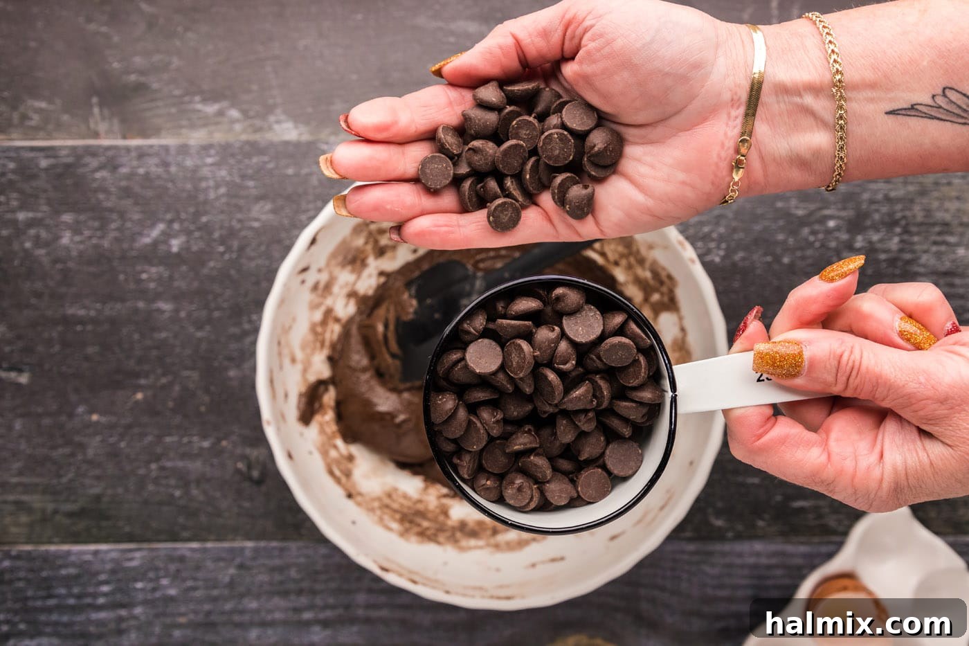 adding dark chocolate chips to brownie mix batter