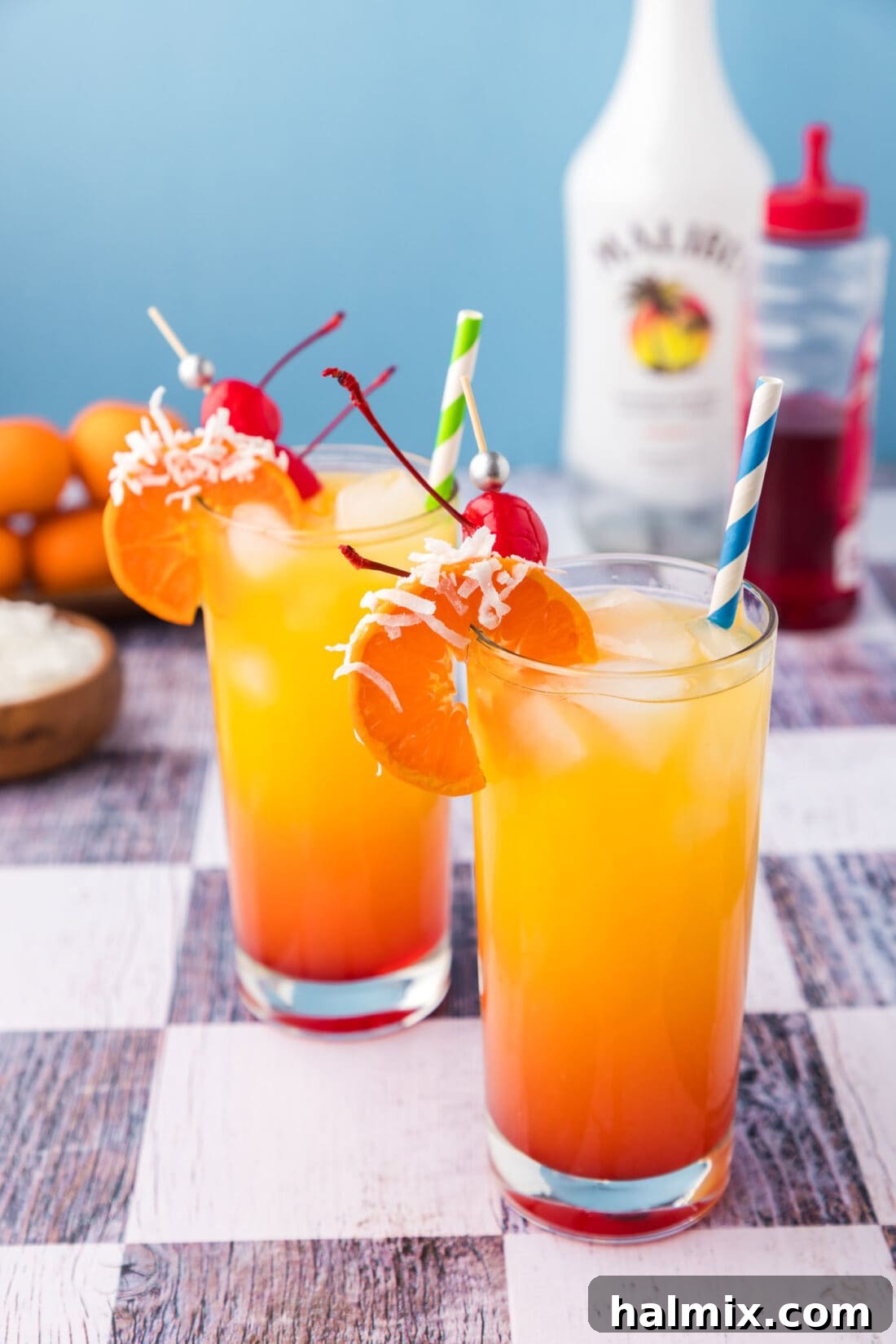 Two beautifully layered Malibu Sunrise drinks ready to be served, perfect for brunch.
