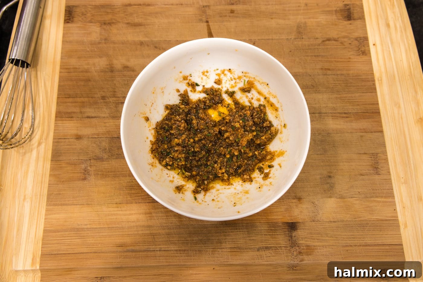 Chargrilled Lamb Loins 6 seasonings mixed with olive oil in a bowl