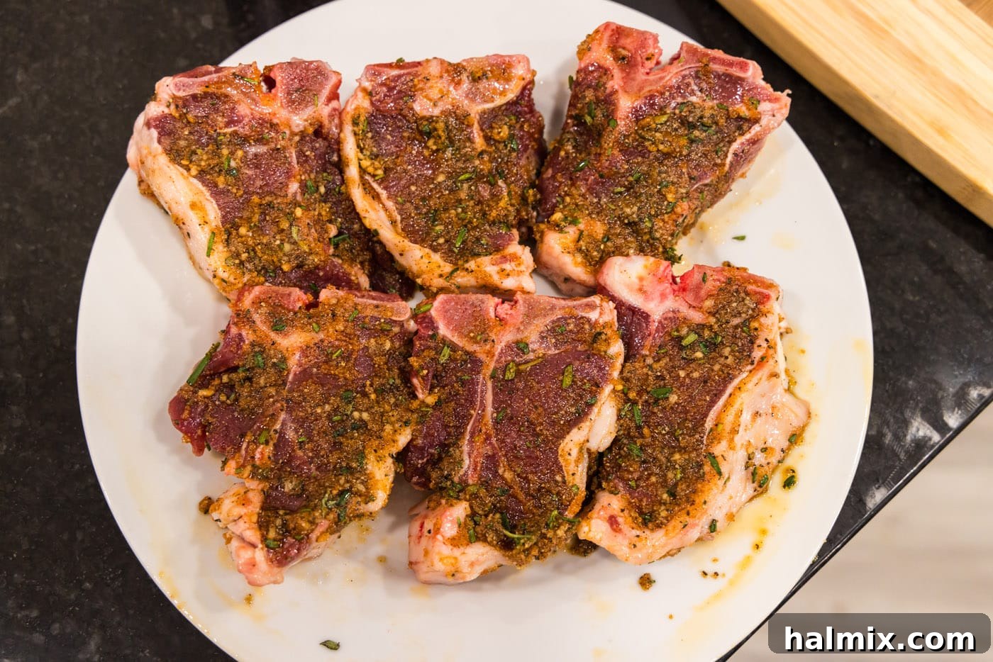 Chargrilled Lamb Loins 8 seasoned lamb loin chops on a plate