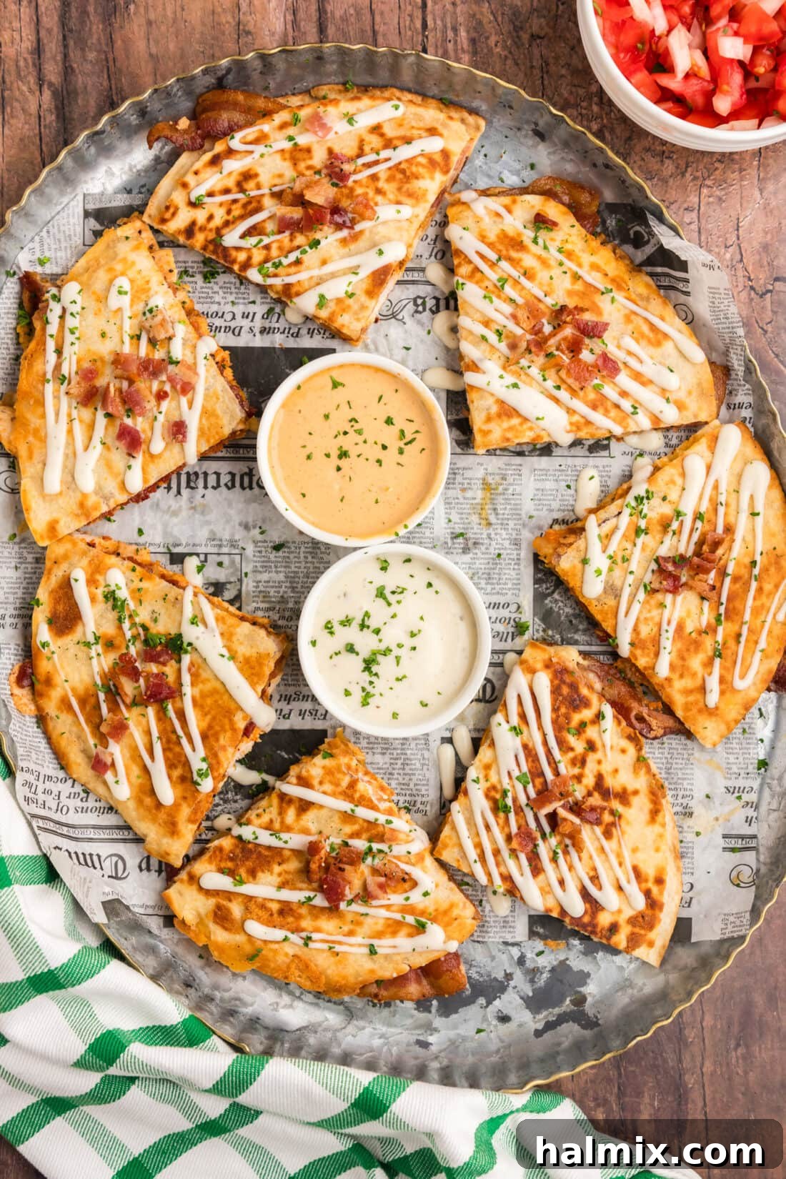 Crispy Ranch Chicken Bacon Quesadillas 18 A platter of golden brown Chicken Bacon Ranch Quesadillas, expertly cut into triangles, arranged for serving.