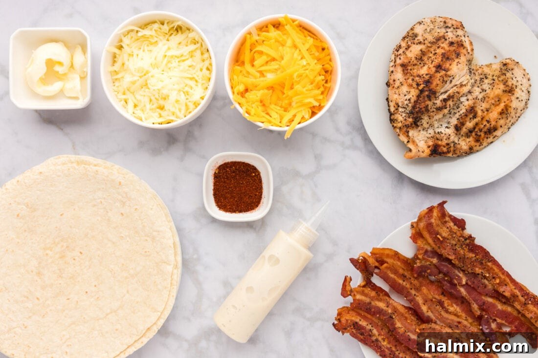 Crispy Ranch Chicken Bacon Quesadillas 4 A flat lay photograph showcasing all the ingredients required for Chicken Bacon Ranch Quesadillas, including tortillas, cheeses, cooked chicken, bacon, ranch dressing, and chili powder.