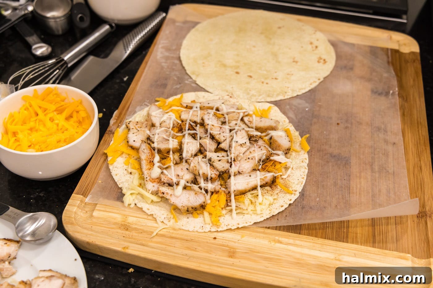 Crispy Ranch Chicken Bacon Quesadillas 10 Ranch dressing drizzled generously over the chicken and cheese on a tortilla.