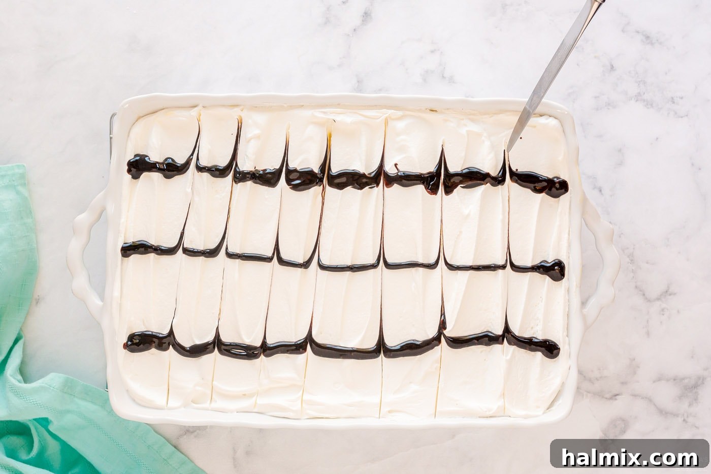 Chocolate Eclair Cloud Cake 14 using a knife to drag chocolate lines