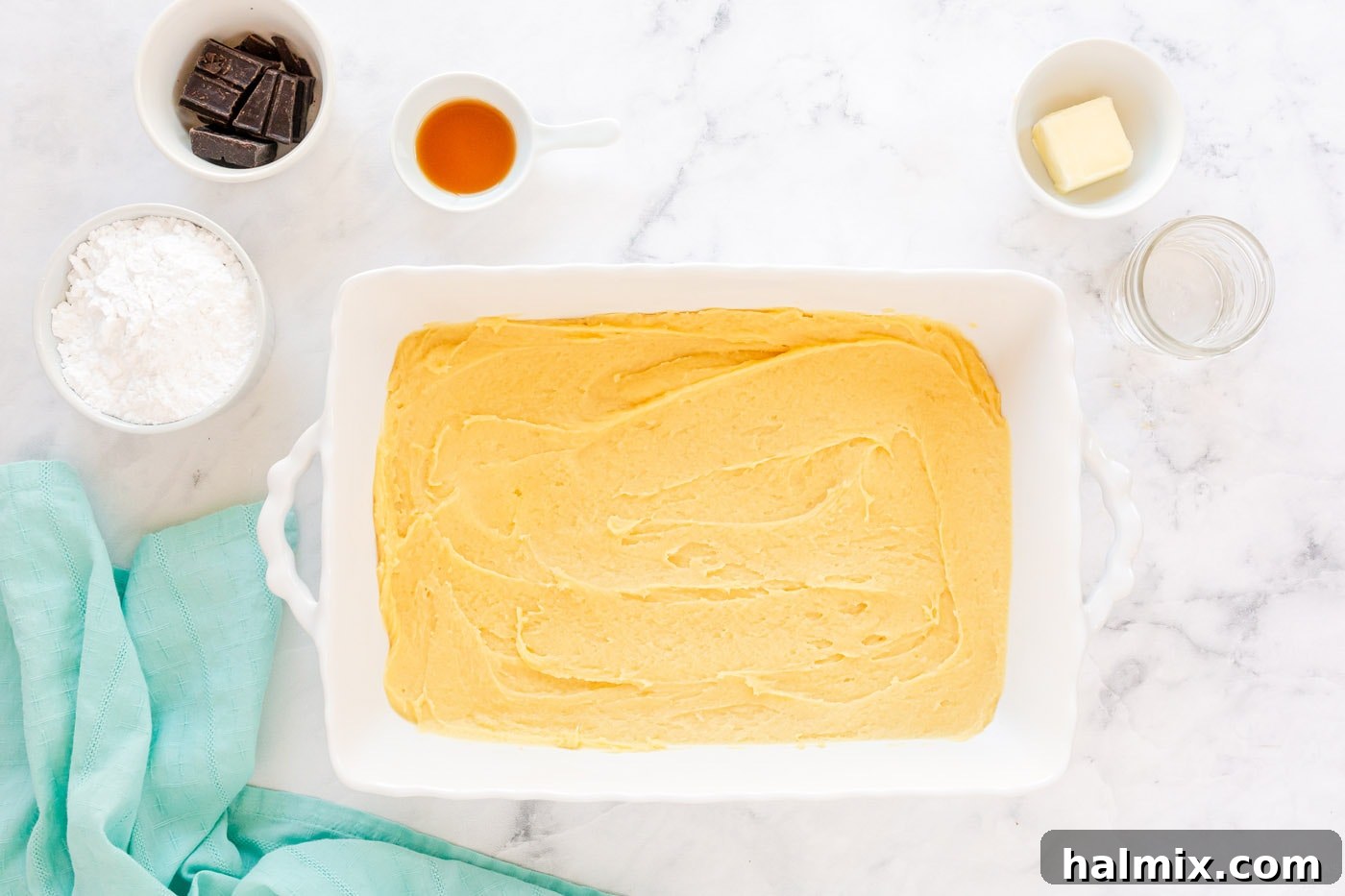Chocolate Eclair Cloud Cake 7 spread dough onto bottom of a 13x9 pan