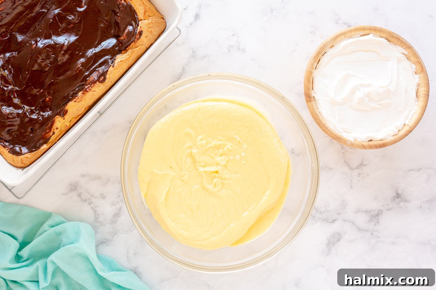 Chocolate Eclair Cloud Cake 10 cream cheese and pudding mixture in a bowl