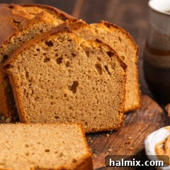 Close up photo of a loaf of Peanut Butter Bread cut into slices