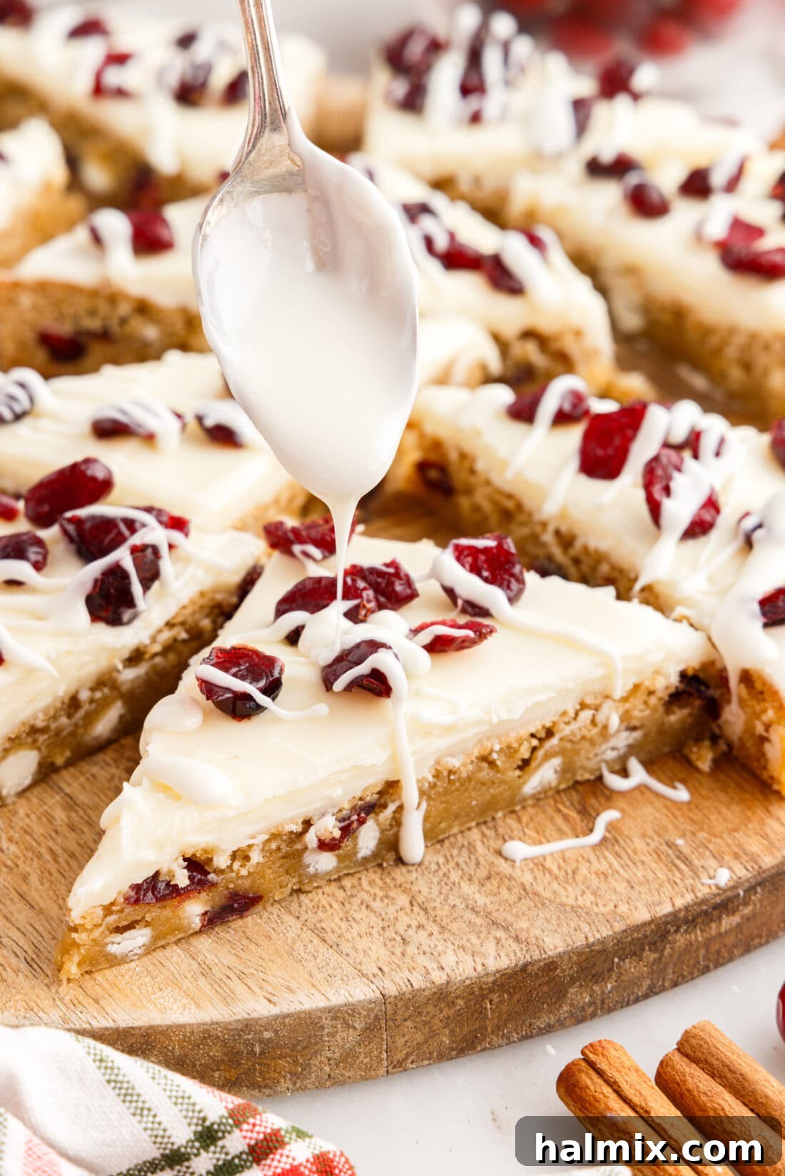 Tangy Cranberry Dream Bars 17 White chocolate bring drizzled over a Cranberry Bliss Bar
