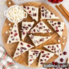 Cranberry Bliss Bars on a wooden serving platter