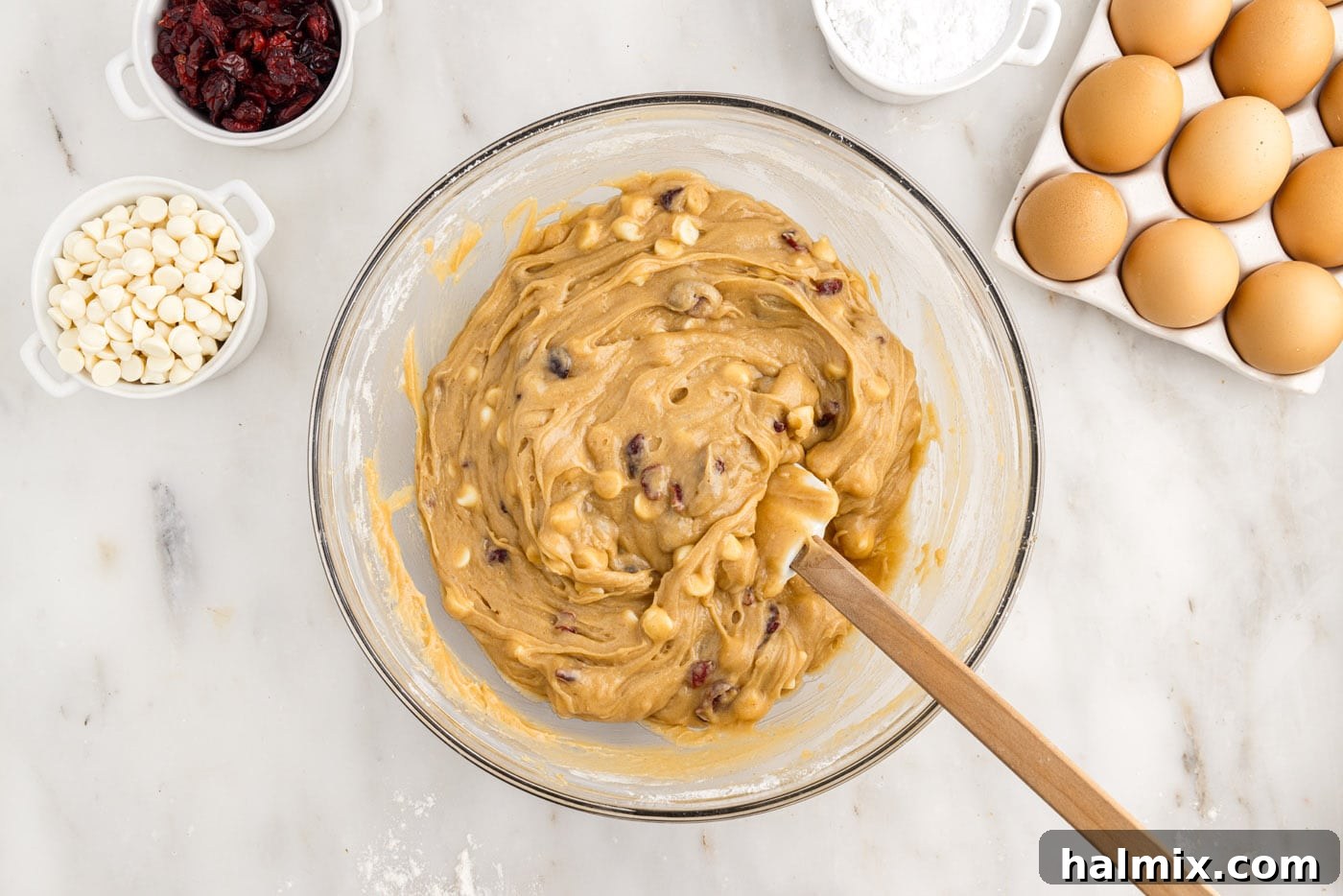 Tangy Cranberry Dream Bars 9 blondie dough with white chocolate chips and dried cranberries in a bowl