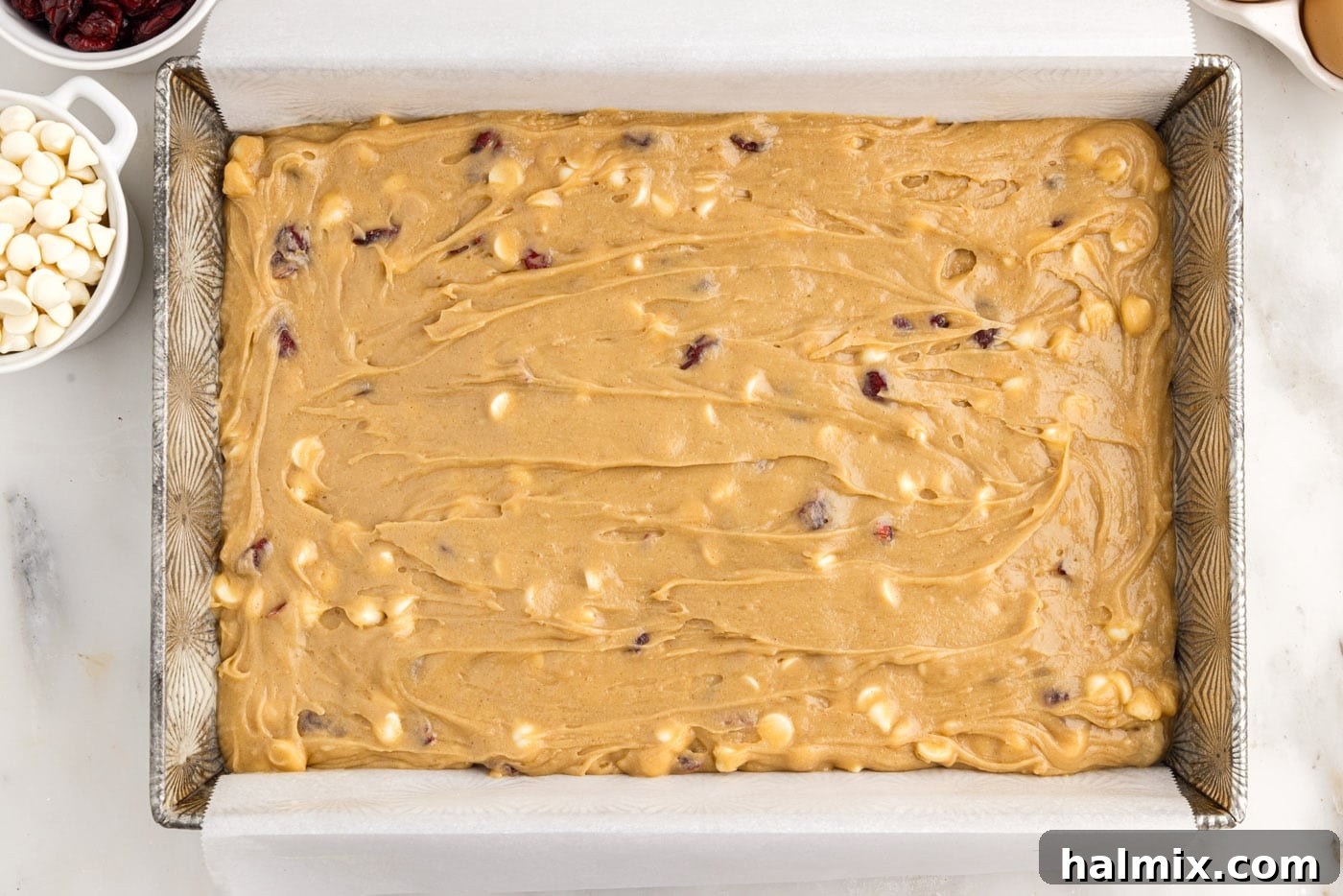 Tangy Cranberry Dream Bars 10 white chocolate cranberry blondies in a baking pan