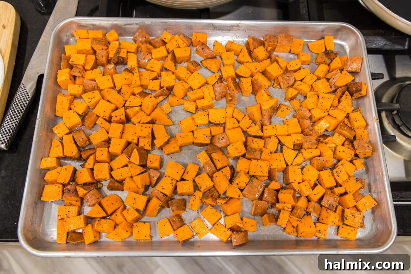 Caramelized Sweet Potatoes 8 cubed sweet potatoes on a baking sheet