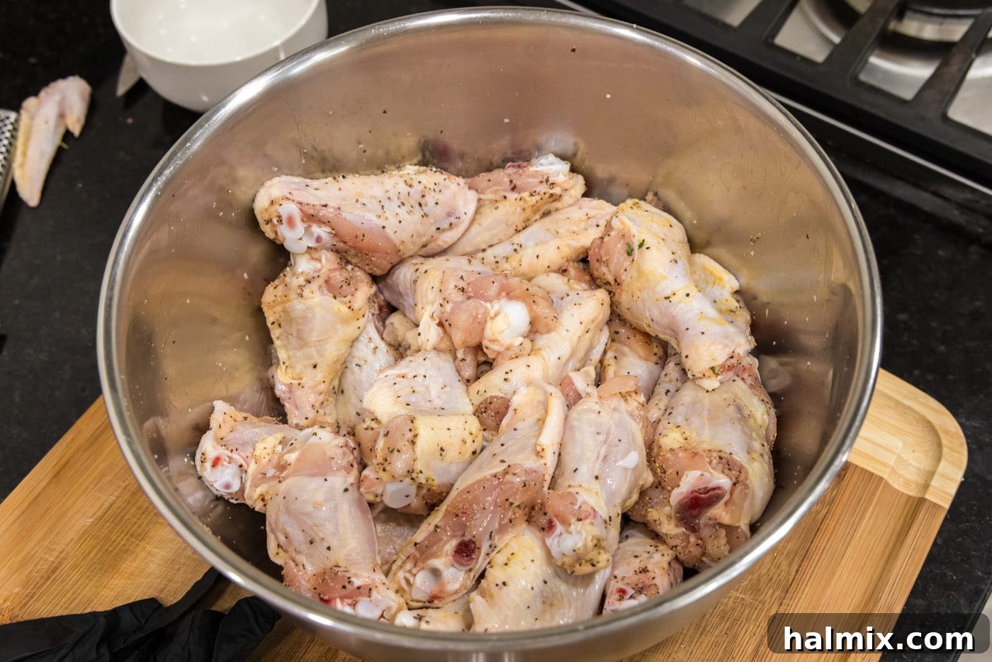 Crispy Garlic Parmesan Wings 6 seasoned chicken wings in a bowl