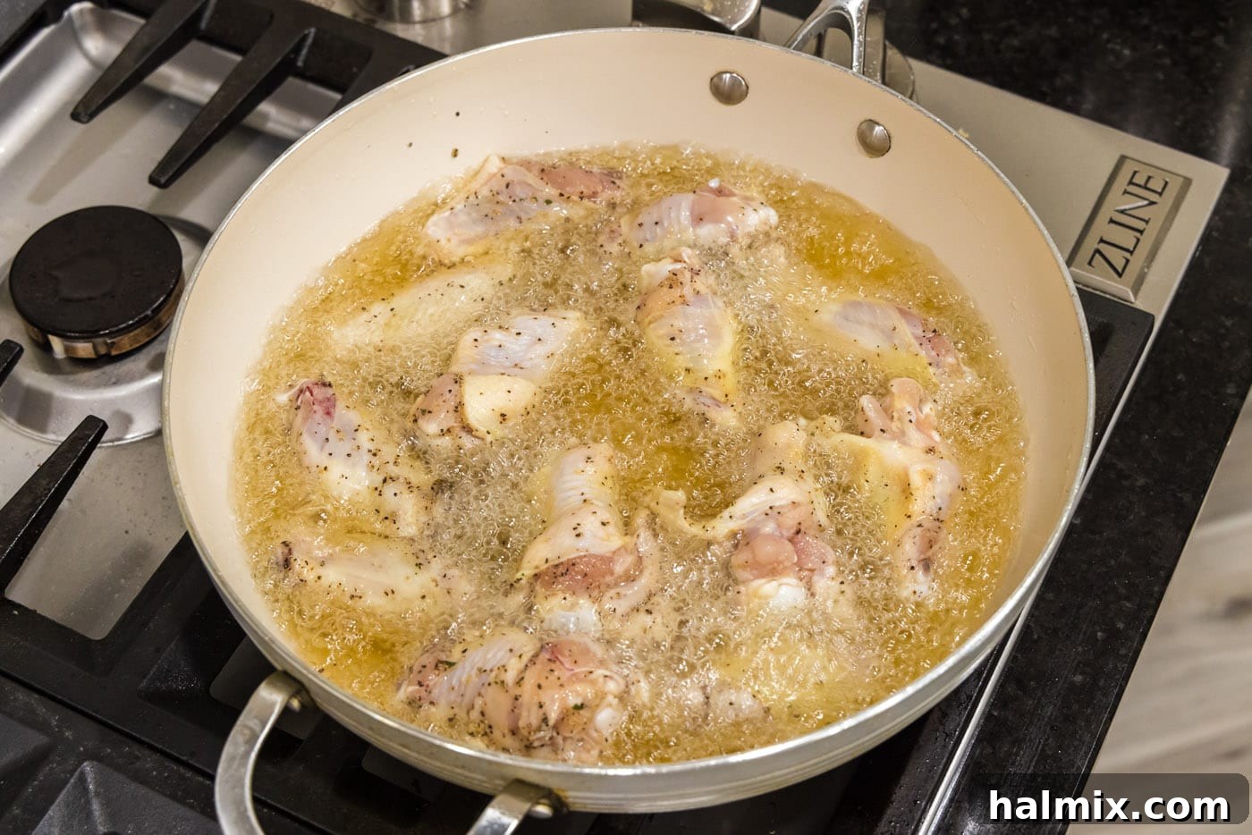 Crispy Garlic Parmesan Wings 7 frying chicken wings in oil