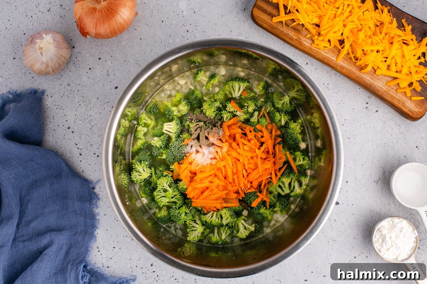 Golden Instant Pot Broccoli Cheddar Soup 8 Broccoli florets, shredded carrots, and seasonings added to the Instant Pot