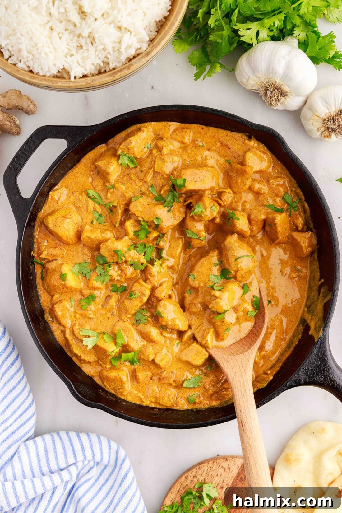 Aromatic Chicken Curry 3 Skillet of Chicken Curry with a spoon in it