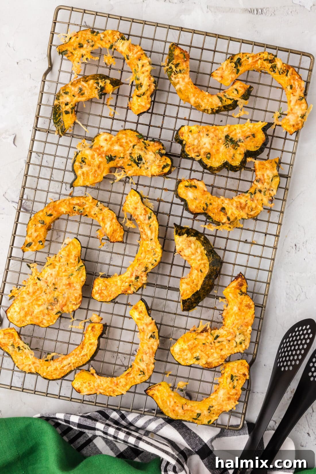 Close-up of crispy Air Fryer Acorn Squash on a wire rack, ready to be served.